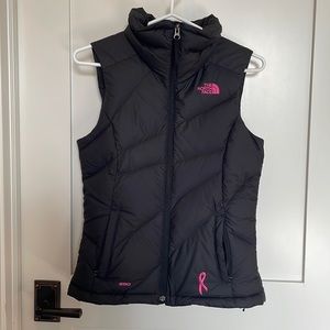 Women's North face Down vest, black with pink. XS
